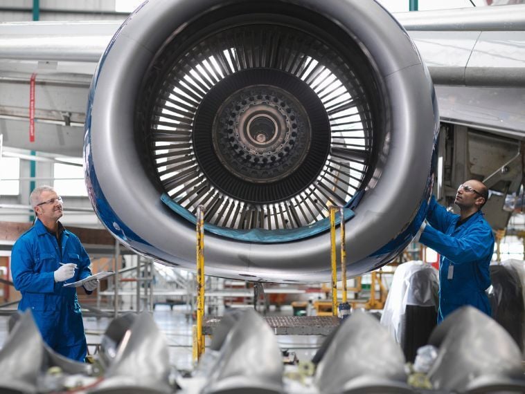 A group of engineer working on a plane